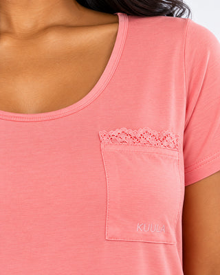 Close-up of Quartz Pink Kuula Nightie lace-trimmed pocket and tonal KUULA embroidery